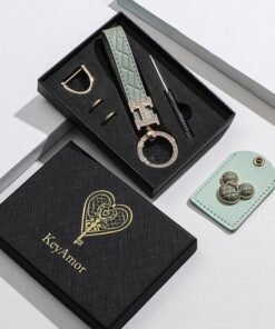 KeyAmor Elegant metal and quilted leather keychain car key holder for adults. Includes a matching AirTag holder.Stylish keychain with golden crystal-accented rings, perfect for women, featuring 3 key rings for added functionality.  Made with elegant mint green leather, offers 360-degree rotation, and comes in a fancy gift box, making it a perfect gift choice.