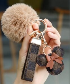 KeyAmor Dark brown keychain with elegant fluffy fur for women , A great option as a gift . Plaid leather and golden metal keychain includes matching accessories