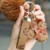 KeyAmor Light brown  keychain with elegant fluffy fur for women  A great option as a gift  Plaid leather and golden metal keychain includes matching accessories